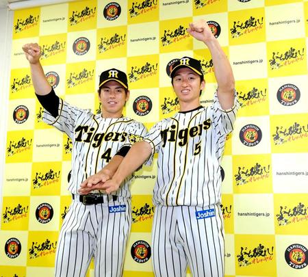　ファン投票で選出され“矢野ガッツ”で活躍を誓う梅野（左）と近本