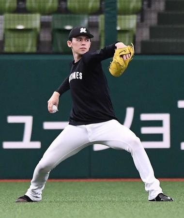 　調整する佐々木朗（撮影・園田高夫）