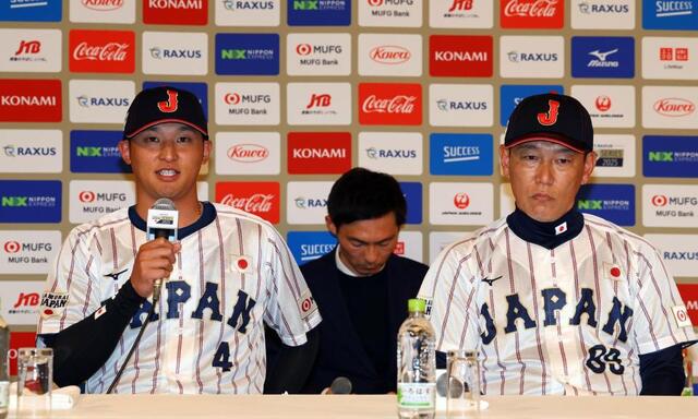 　会見する吉川（左）と井端監督（撮影・山口登）