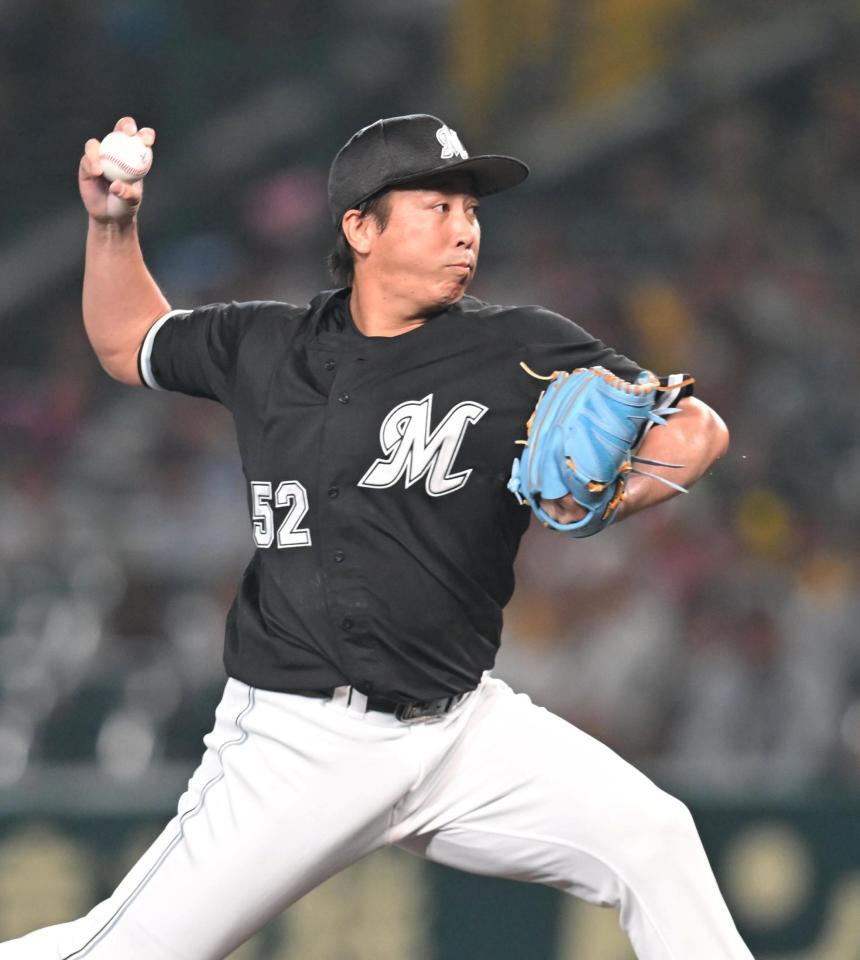 　７回、力投する益田（撮影・飯室逸平）