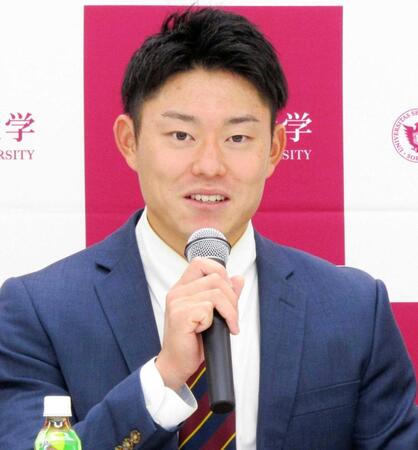 　会見する上智大・正木