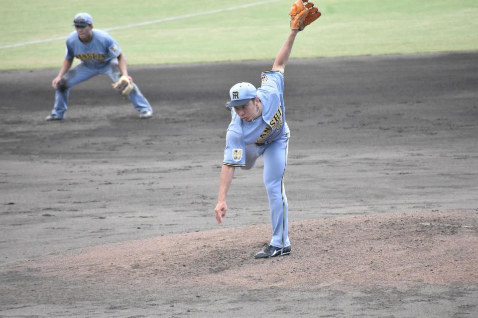 力投する石井