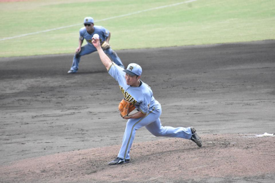力投する石井