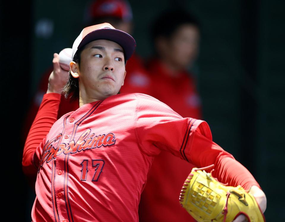 　ブルペンで投球練習する常広（撮影・山口登）