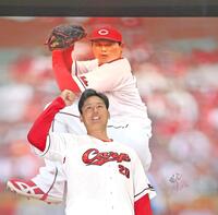 壁画の前で拳を握る栗林（撮影・北村雅宏）