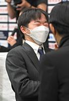 　滑走順抽選の結果に苦笑いの鍵山優真（撮影・高部洋祐）