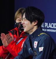 　男子ＳＰの演技を終え、笑顔を見せる山本草太（大会組織委提供）