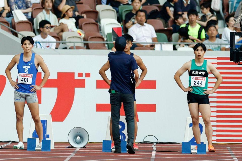 　男子１００メートル予選　不正スタートで失格となった柳田大輝（中央）