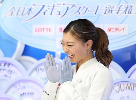 　点数に笑顔を見せる坂本花織（撮影・石井剣太郎）