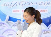 　点数に笑顔を見せる坂本花織（撮影・石井剣太郎）