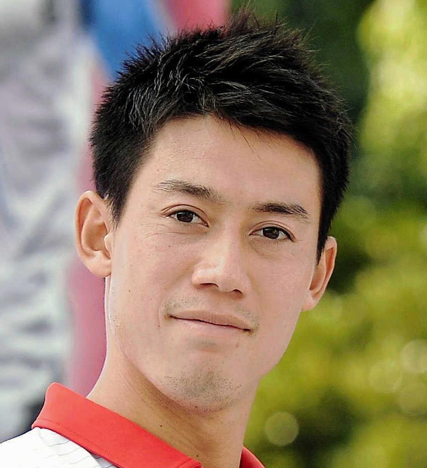 雨で試合開始が遅れた錦織圭