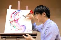 　２１年９月、アートフェスで自画像を描く画家の杉田陽平氏