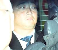 初公判を終え車で引き揚げる斉籐慎二被告
