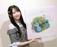 制作途中の油絵を披露する橋本真希（撮影・棚橋慶太）