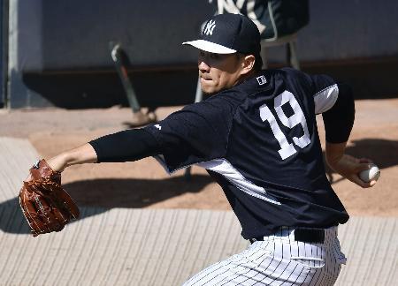 田中はブルペンで２９球