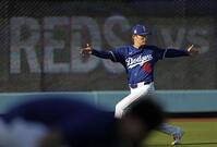 　調整する山本（共同）