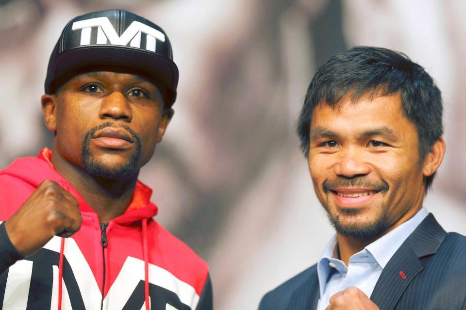 　「世紀の対決」を控え、記者会見に臨んだメイウェザー（左）とパッキャオ