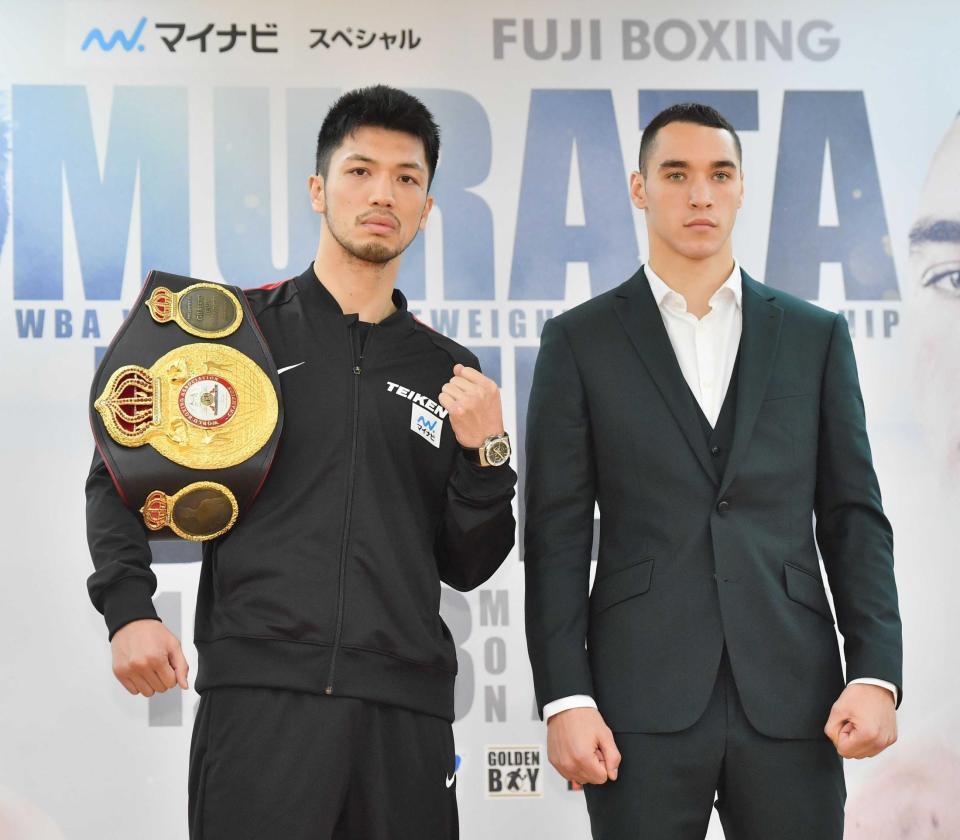 　無表情なバトラー（右）の横でガッツポーズする村田諒太（撮影・園田高夫）