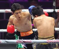 　１回、キティデッチ・ヒランス（右）に左フックを放つ荒竹一真（撮影・西岡正）