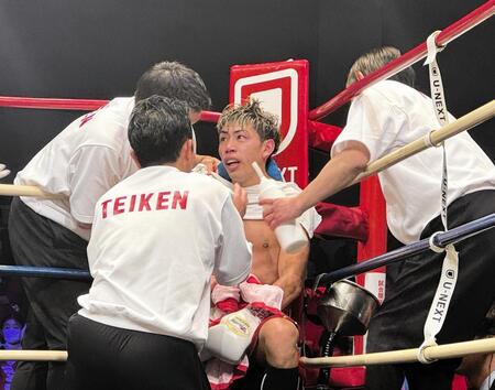 ６回にダウンを喫し、インターバルで回復に努める村田昴