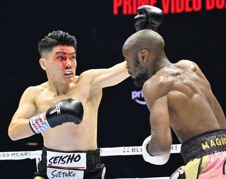 １回、リカルド・マラジカ（右）を攻める坪井智也　