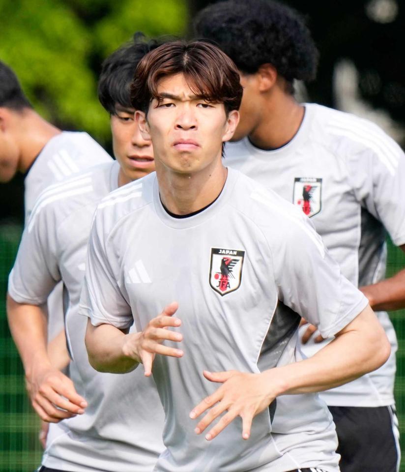 　調整する宮代（共同）