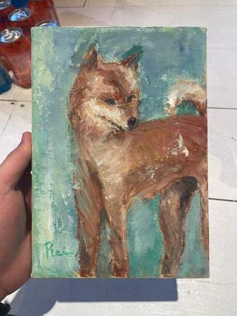 佐野さんが東京・杉並区の古道具屋で購入したという犬の絵。額を外すと絵にそっくりの柴犬の写真が出てきた（佐野さん提供）