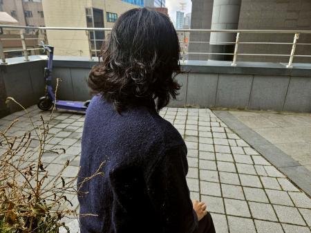 　韓国軍によるビラ散布について証言する元軍人＝１４日（共同）