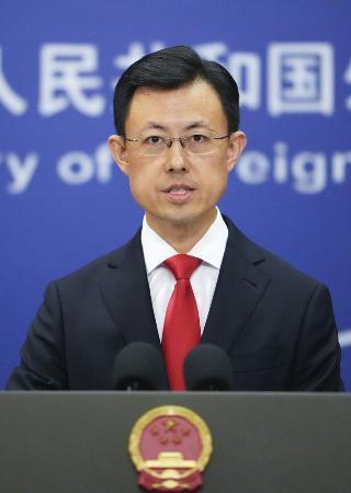 　９月３０日、記者会見する中国外務省の郭嘉昆副報道局長＝北京（共同）