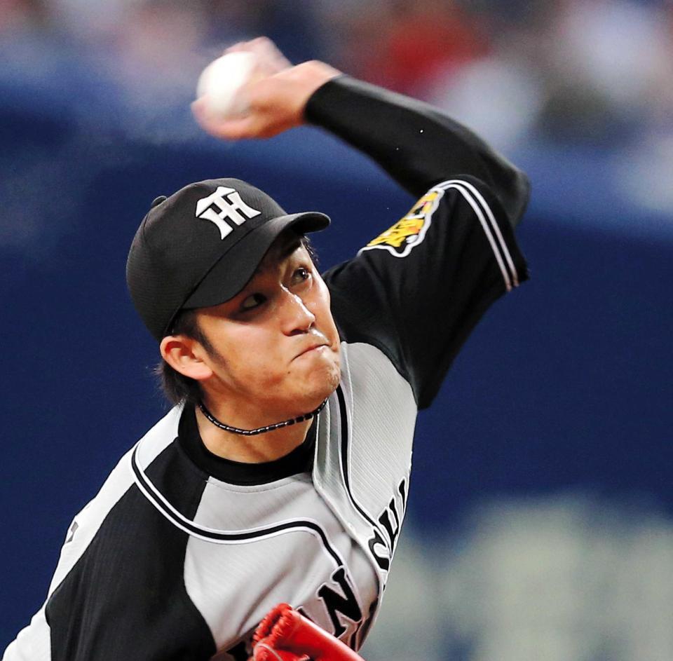 　気迫の投球をみせる岩貞（撮影・飯室逸平）