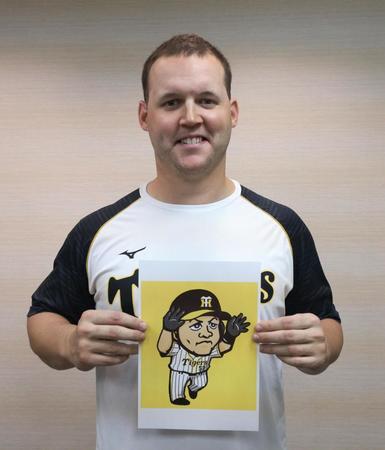 　“ハッピーハンズ”のイラストを持つ阪神　ジェリー・サンズ（阪神タイガース提供）
