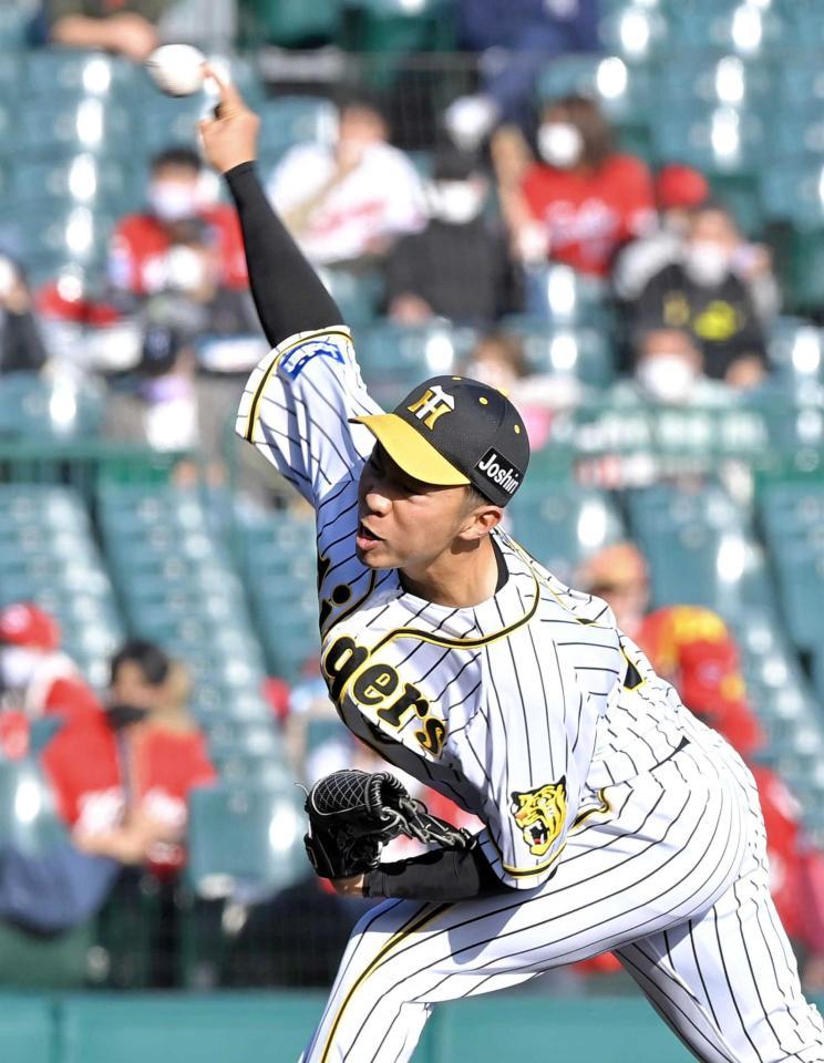 　力投する石井大