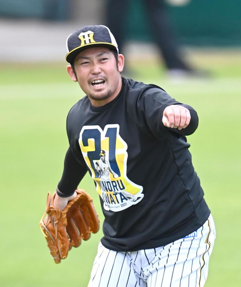 　試合前の練習で汗を流す岩田稔（撮影・飯室逸平）