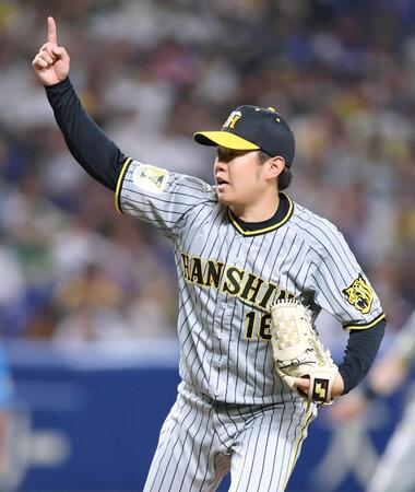 　２回、スイングをアピールする西勇