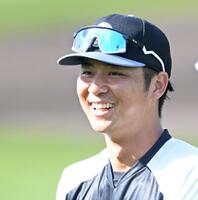 　充実の笑顔を見せる井坪（撮影・飯室逸平）