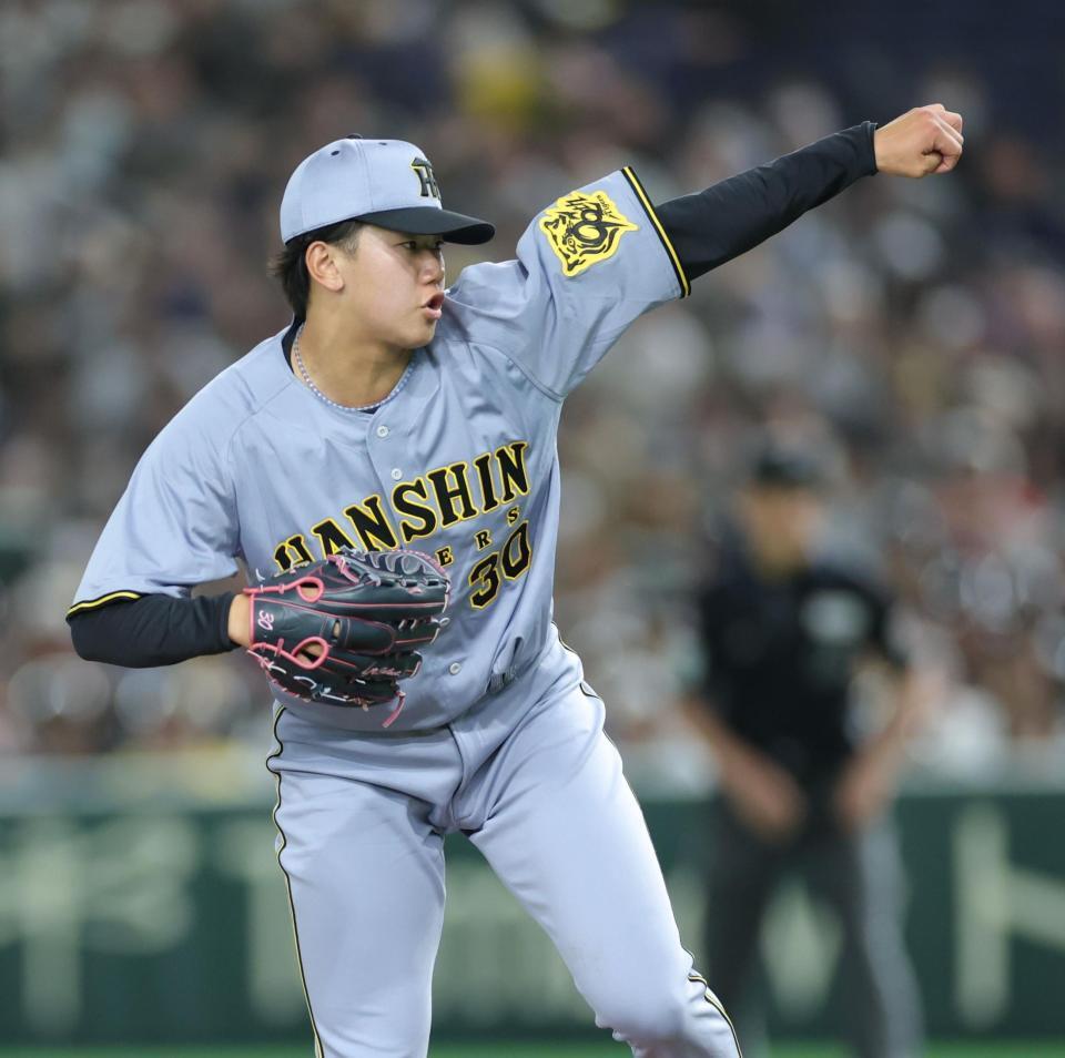 　３回、カブス打線を相手に力投する門別（撮影・西岡正）