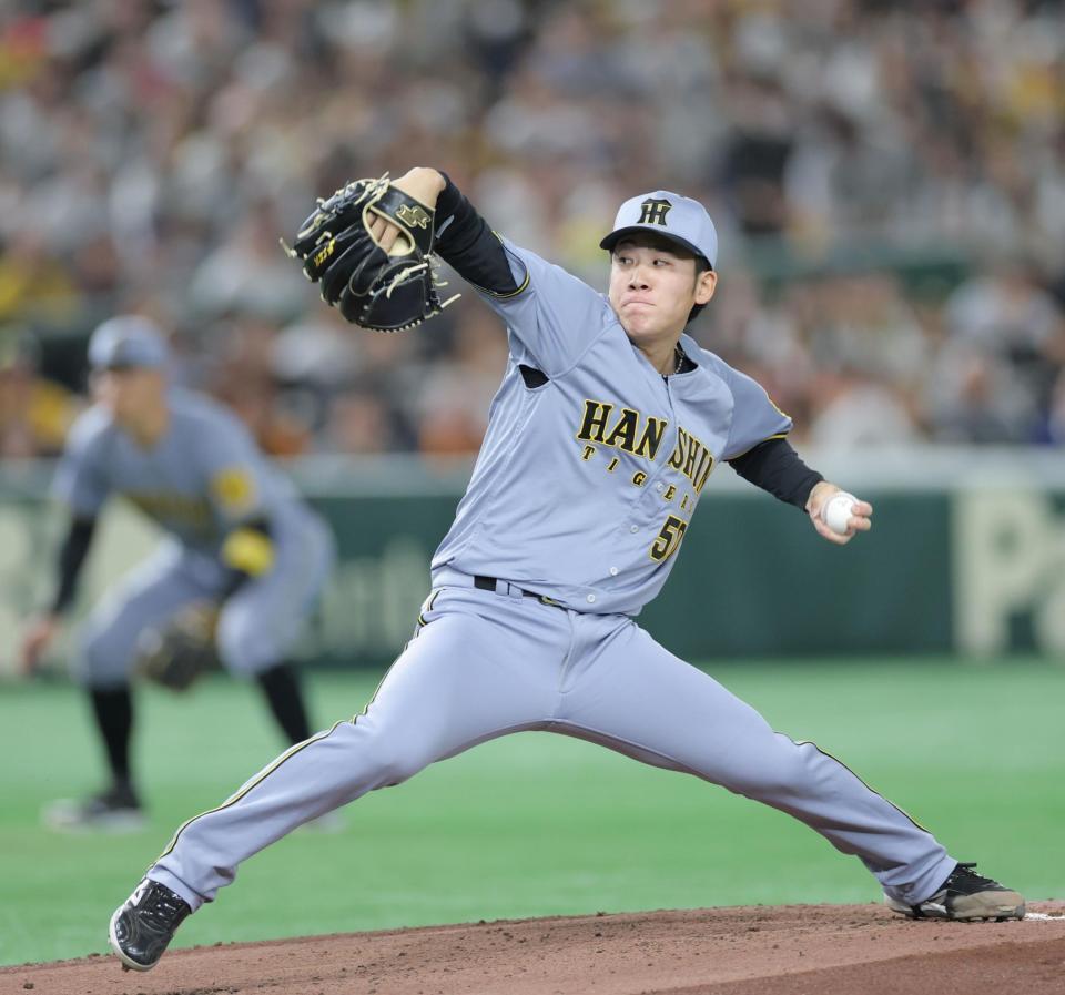 力投する富田（撮影・西岡正）