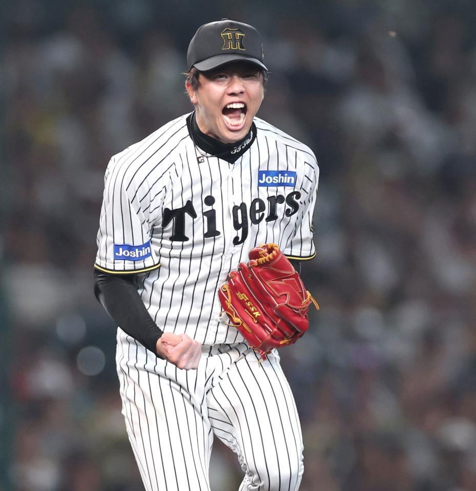 　６回、ピンチで山本を空振り三振に仕留め、ほえる才木（撮影・北村雅宏）