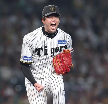 　６回、ピンチで山本を空振り三振に仕留め、ほえる才木（撮影・北村雅宏）