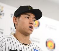 　支配下登録され会見する早川（撮影・西田忠信）