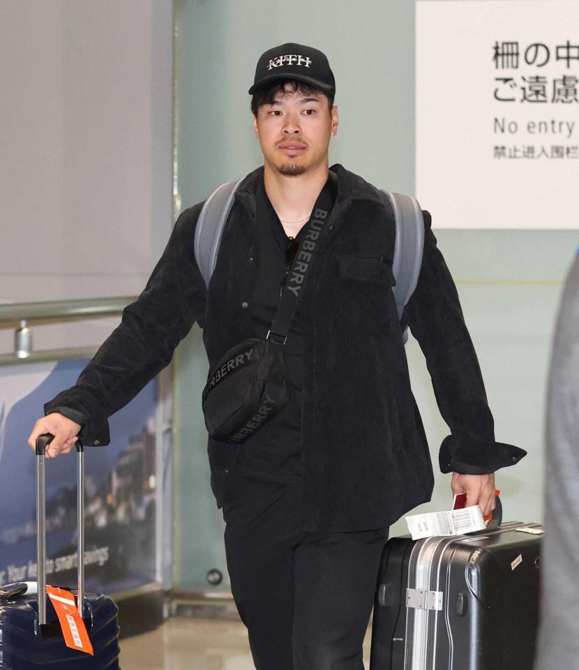 　帰国した佐藤輝