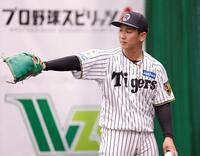 ブルペンで投球練習する阪神・伊原陵人＝宜野座（撮影・西田忠信）