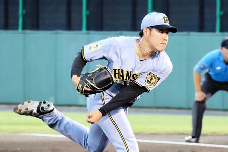 初回、力投する先発の富田